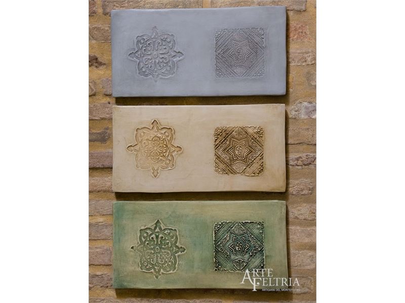 Formella rettangolare con rosone e stella